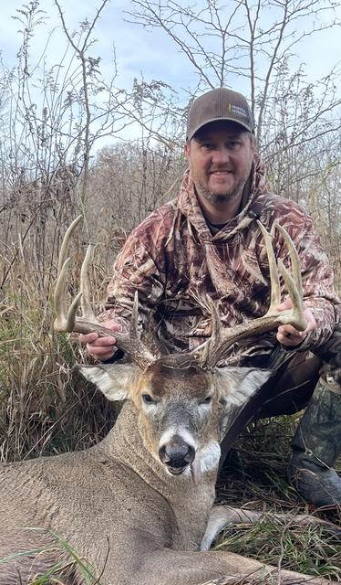 Dave in camo with a big whitetail buck